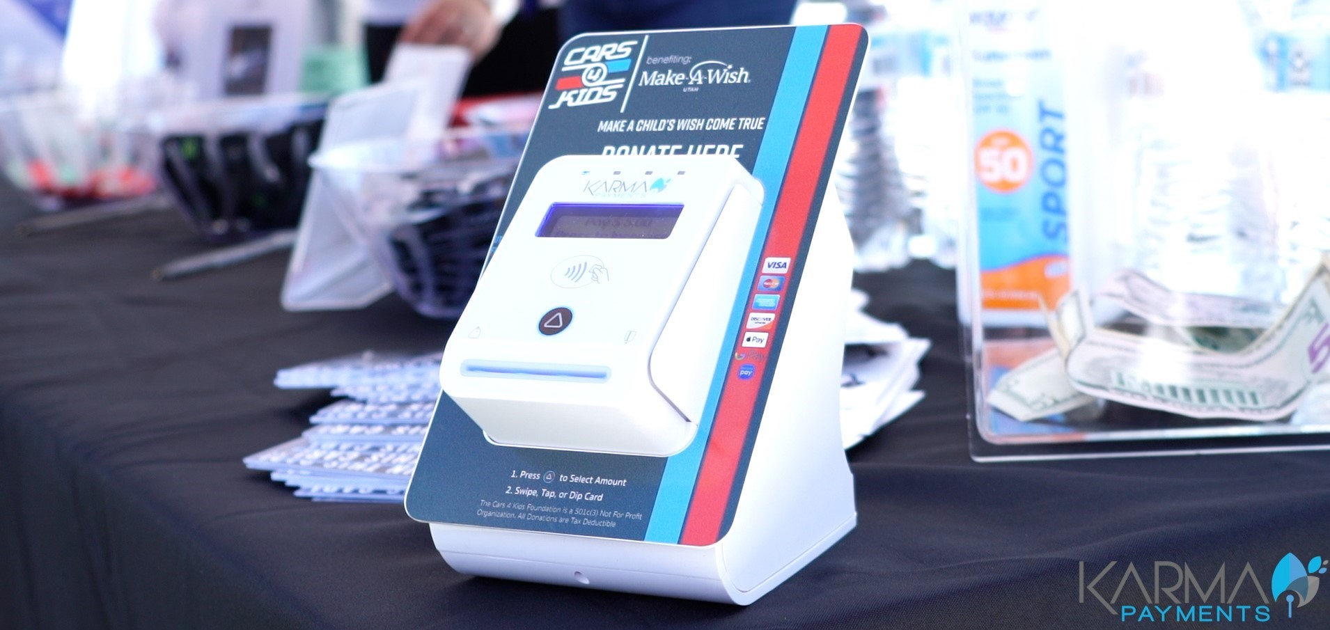 Portable donation kiosk device for mobile fundraising at a Make A Wish event